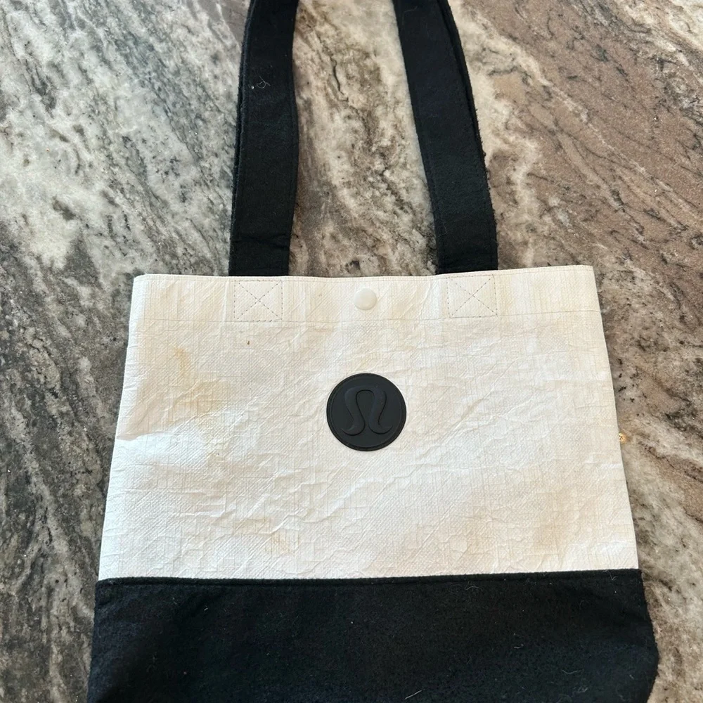 lululemon athletica Black and Cream Tote has wear stains piling
